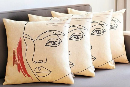 Set of Four 18" Ivory Black and Red Abstract Face Fabric Throw Pillows