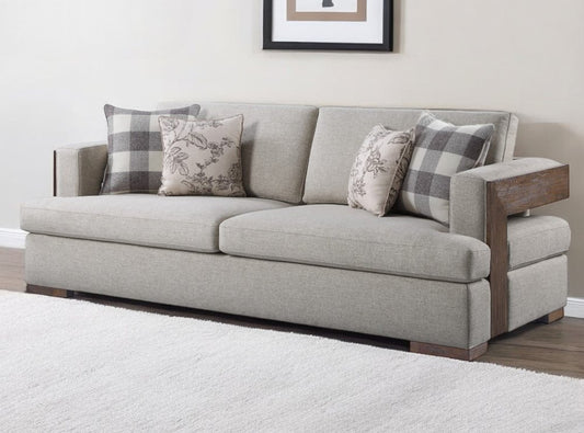 92" Beige Fabric Sofa And Toss Pillows With Brown Legs