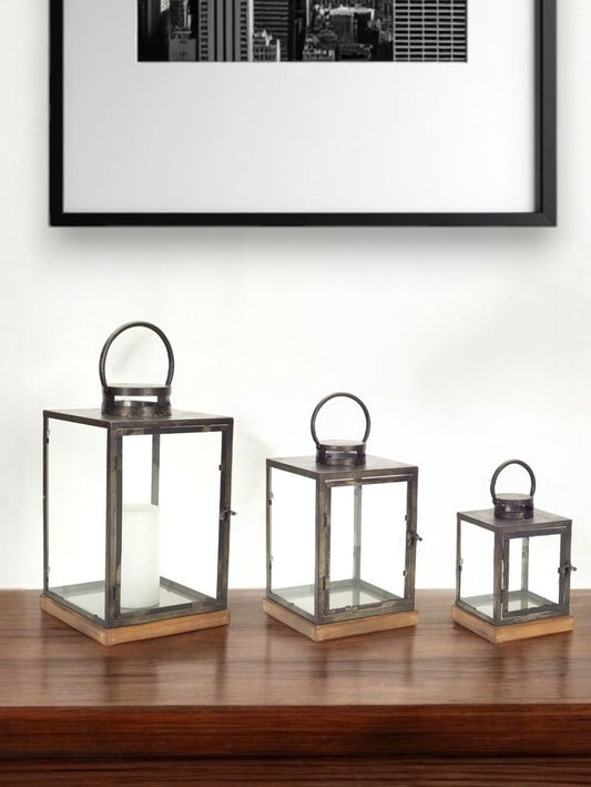 Set of Three Gray And Brown Distressed Geometric Glass Metal And Wood Floor Lantern Candle Holders