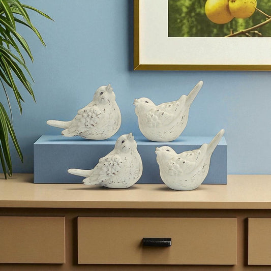 Set of Four Ivory Ceramic Bird Figurines