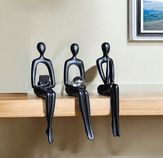 Set of Three Black Resin People Tabletop Sculpture