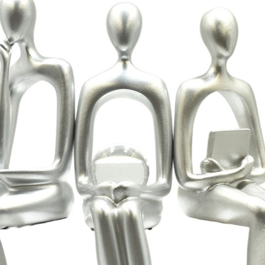 Set of Three Silver Resin People Tabletop Sculpture