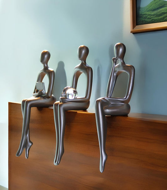 Set of Three Silver Resin People Tabletop Sculpture