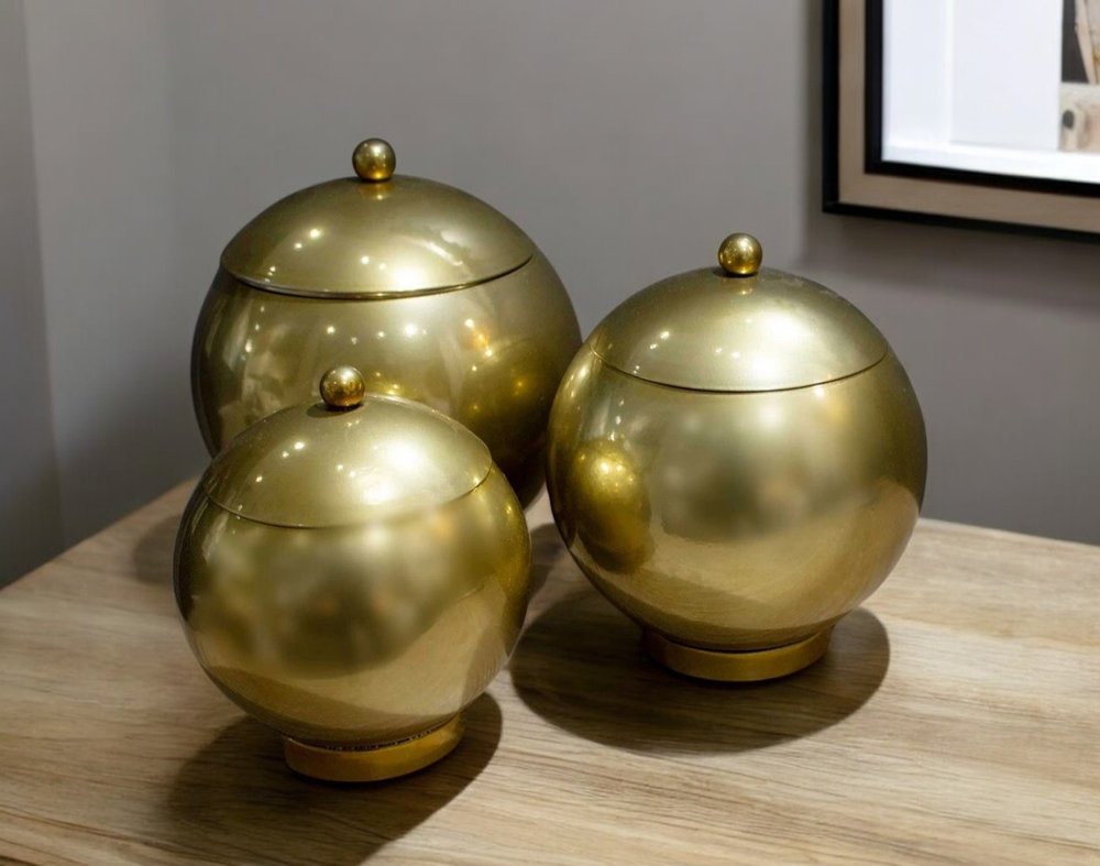 Set of Three Gold Metal Decorative Lidded Canisters
