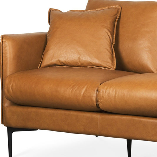 86" Tan Leather Sofa And Toss Pillows With Black Legs