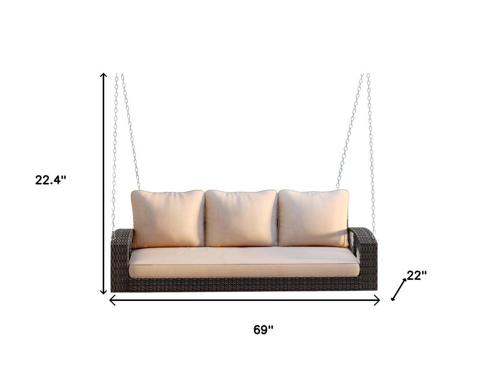 69" Brown Woven Rattan Outdoor Swing Chair with Beige Cushions