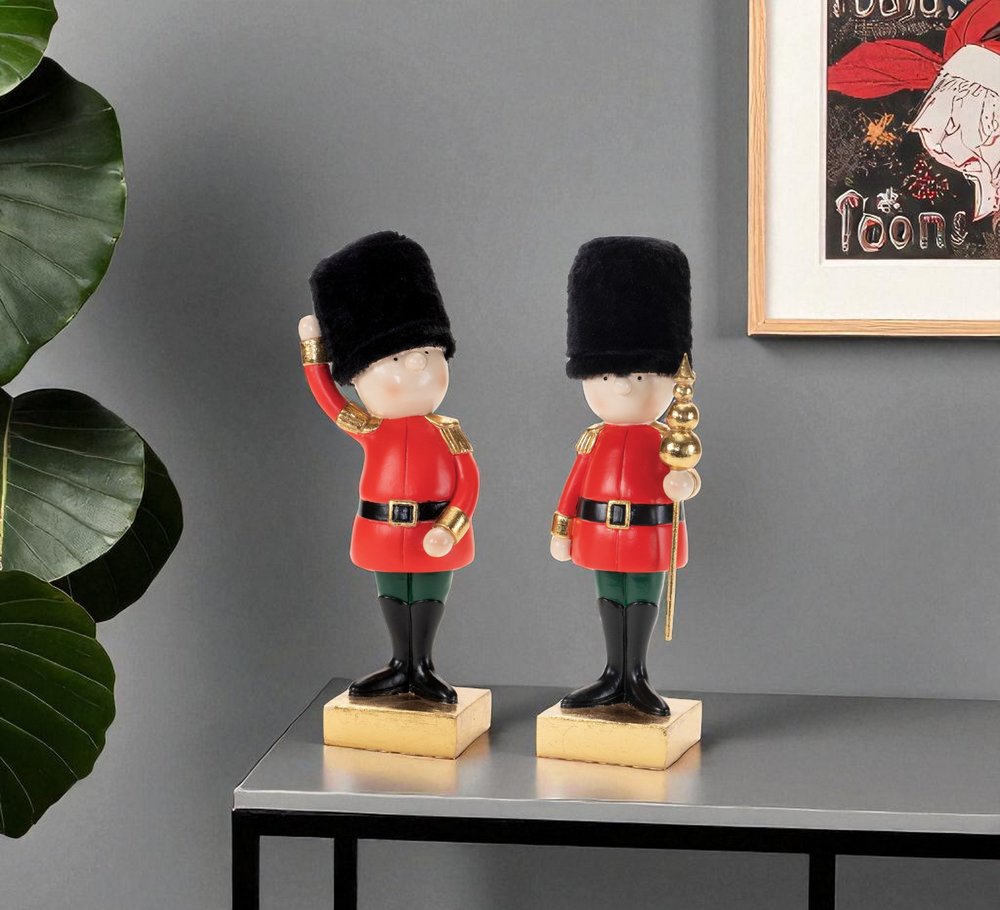 Set of Two Black Gold And Red Polyresin Christmas Nutcracker Figurines