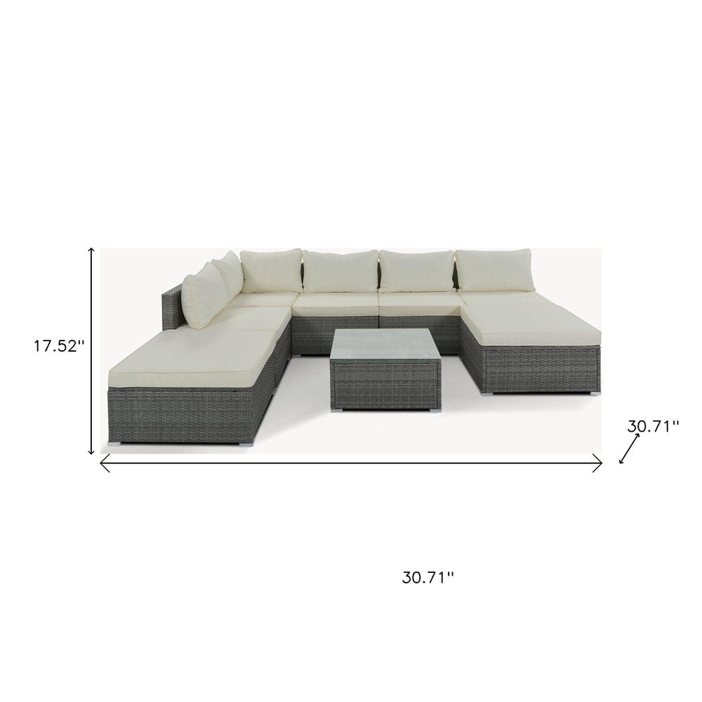 Eight Piece Gray and Beige Wicker Upholstered Cushions Sectional Seating Group With Table