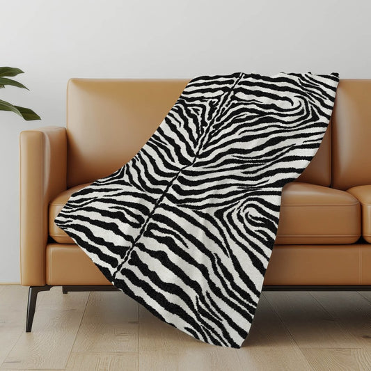 50" X 70" Black And Ivory Animal Print Polyester Woven Plush Throw Blanket