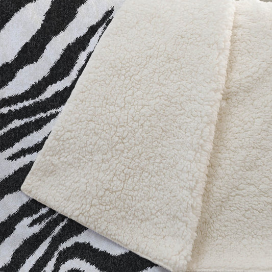 50" X 70" Black And Ivory Animal Print Polyester Woven Plush Throw Blanket