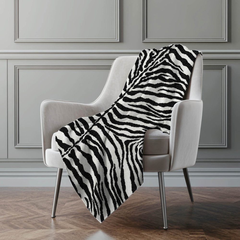 50" X 70" Black And Ivory Animal Print Polyester Woven Plush Throw Blanket