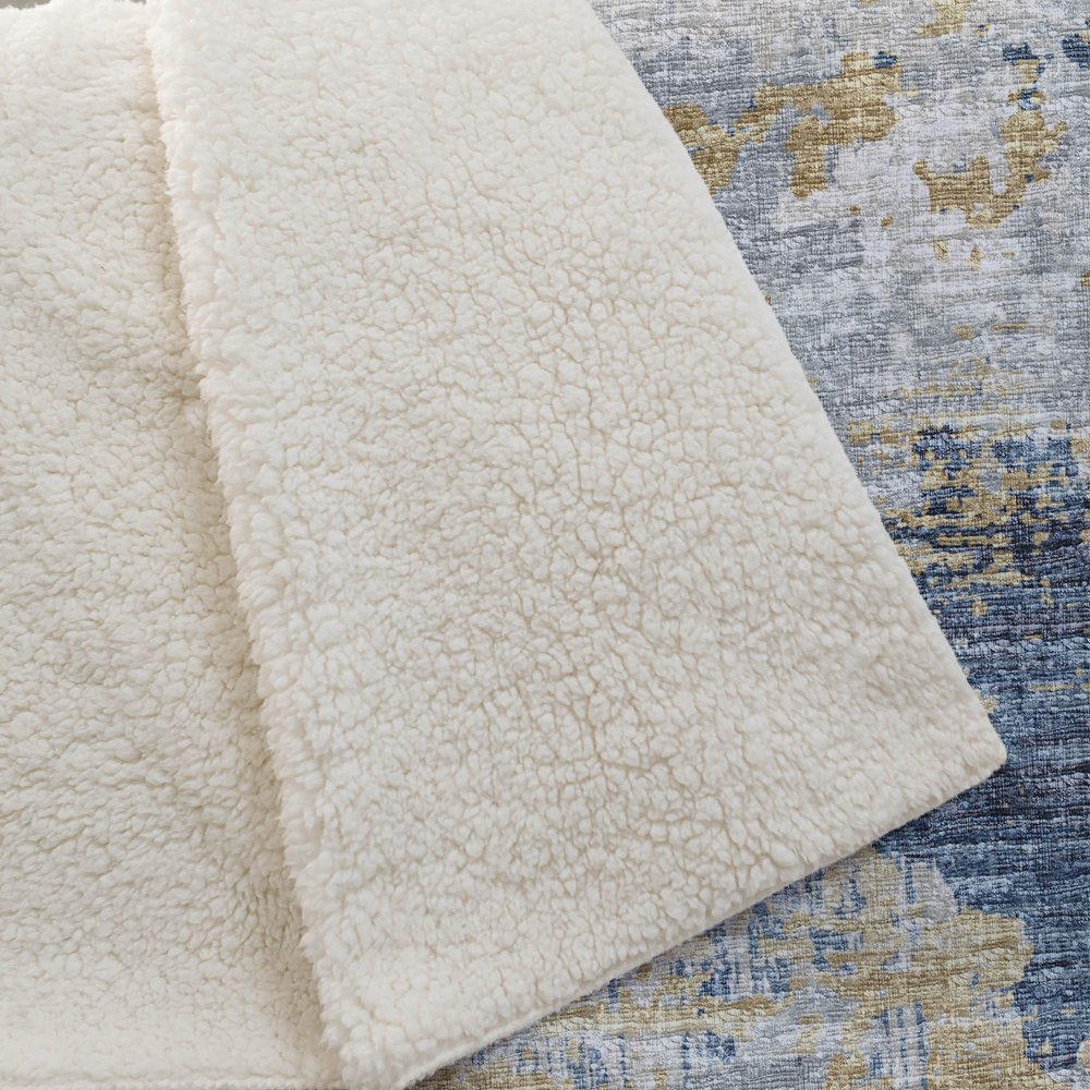 50" X 70" Blue Gold And Ivory Abstract Polyester Woven Plush Throw Blanket