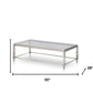 55" Clear and Silver Glass And Steel Coffee Table