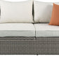 Three Piece Outdoor Gray Wicker Sectional Seating Group with Beige Cushions