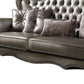 46" Platinum Faux Leather Curved Sofa And Toss Pillows