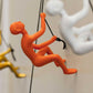 6" X 3" Orange Resin Climbing Man Hanging Dimensional Sculpture