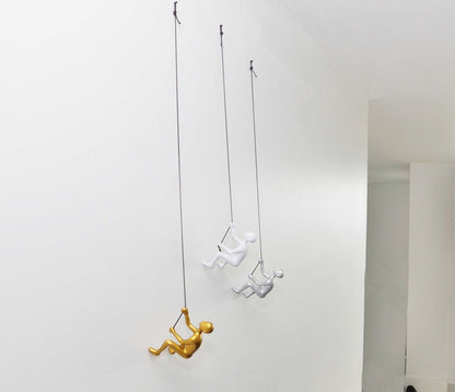 Set of Three Gold Silver And White Resin Climbing Man Hanging Dimensional Sculpture
