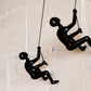 Set of Two Black Resin Climbing Man Hanging Dimensional Sculpture