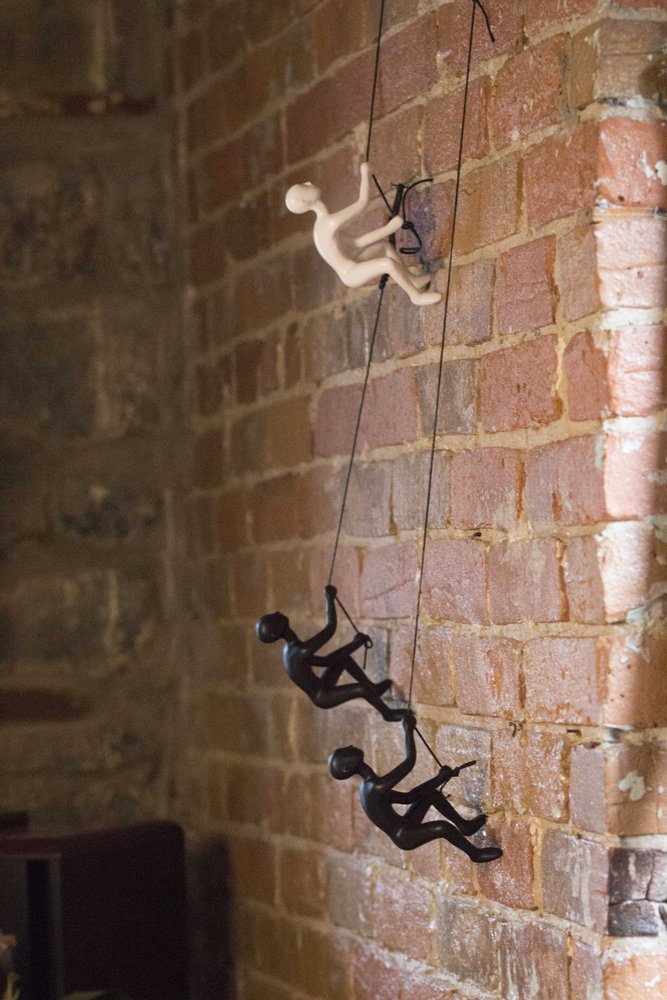 Set of Two Black Resin Climbing Man Hanging Dimensional Sculpture