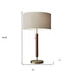 26" Antiqued Brass Solid Wood Table Lamp With Beige Drum Shade