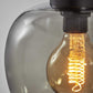 Smoked Glass Globe Shade With Vintage Edison Bulb And Matte Black Metal Wall Lamp
