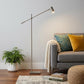 63" Black And Gold Adjustable LED Task Floor Lamp With Antiqued Brass Metal Cylinder Shade