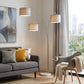 74" Brass Three Light Arc Floor Lamp With Off White Fabric Drum Shade