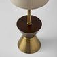 23" Brass Metal And Wood Table Lamp With Beige Drum Shade
