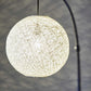 77" Antiqued Bronze Arched Floor Lamp With Groovy Beige Abstract Wicker Globe Shade
