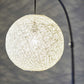 77" Antiqued Bronze Arched Floor Lamp With Groovy Beige Abstract Wicker Globe Shade