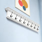 51" White Solid Wood Eight Hook Wall Mount Coat Rack