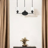 Three Light Matte Black Wall Light with Clear Glass Shade