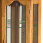 Golden Oak Scallop Top Lighted Corner Curio Cabinet