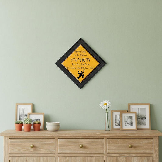 Stupidity Black Framed Print Wall Art