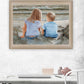 Boy and Girl Sitting in Dunes Brown Framed Print Wall Art