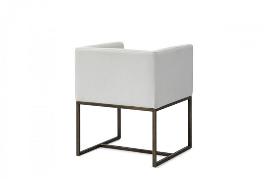 Off White and Antiqued Brass Upholstered Fabric Dining Arm Chair