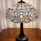 23" Dark Brown Metal Two Light Candlestick Table Lamp With White Shade