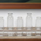 Set of Five Clear Cylinder Glass Decorative Bottles