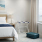 White Folding Luggage Rack With Navy Blue Straps