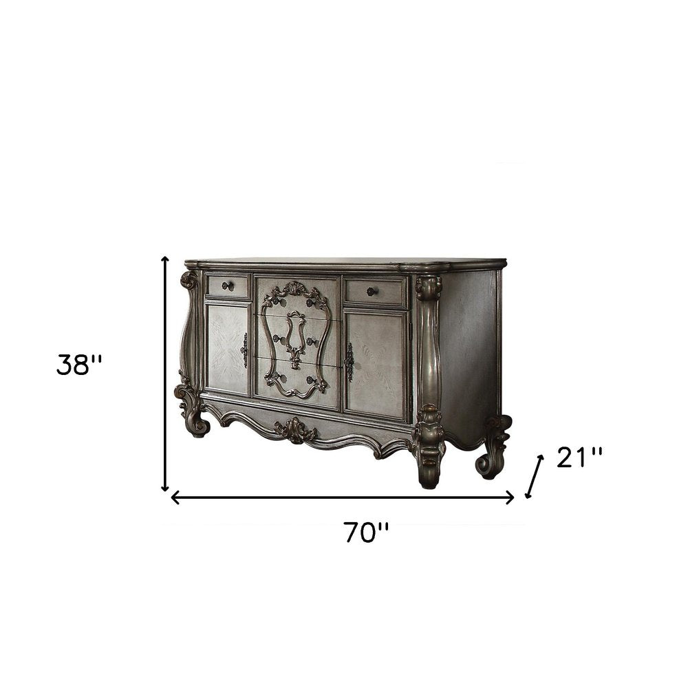 70" Platinum Carved Scrollwork Wood And Polyresin Five Drawer Triple Dresser