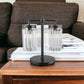 18" Black Iron Two Light Cylinder Bedside Table Lamp With Clear Cylinder Shade