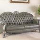 96" Bone Faux Leather Sofa And Toss Pillows With White Legs
