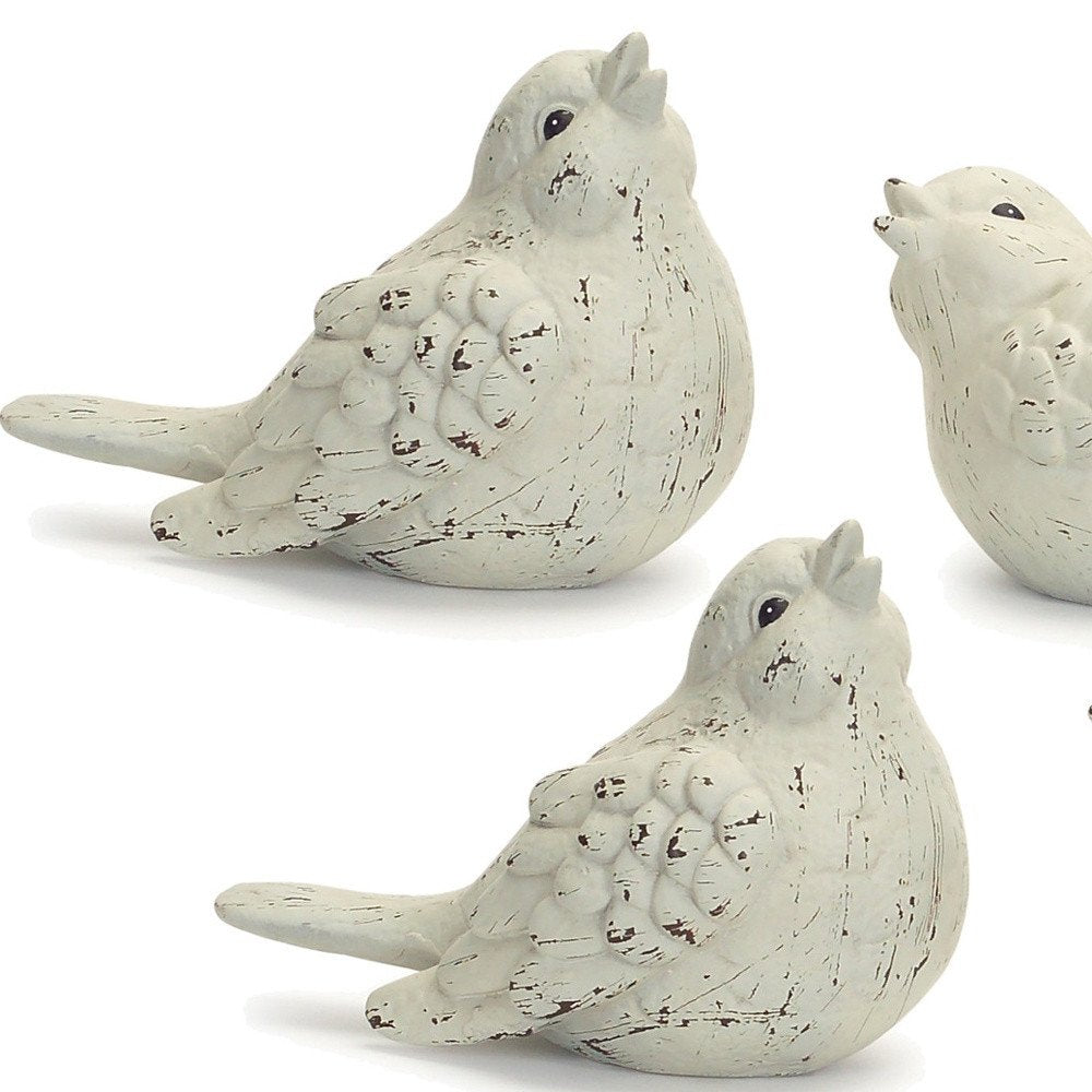 Set of Four Ivory Ceramic Bird Figurines