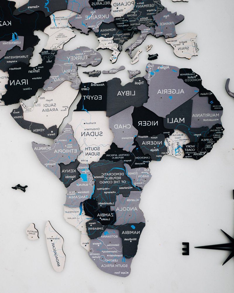 35" X 59" Black Gray and White Wood World Map Hanging Dimensional Sculpture