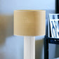 24" White Ceramic Cylinder Table Lamp With Beige Drum Shade