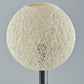 24" Antiqued Bronze Metal Candlestick Table Lamp With Off White Globe Shade