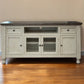70" Ivory Solid Wood Enclosed Storage Distressed TV Stand