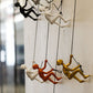 Set of Five Black Gold Orange Silver And White Resin Climbing Man Hanging Dimensional Sculpture