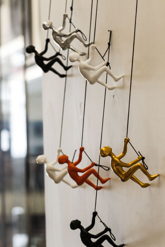 Set of Five Black Gold Orange Silver And White Resin Climbing Man Hanging Dimensional Sculpture
