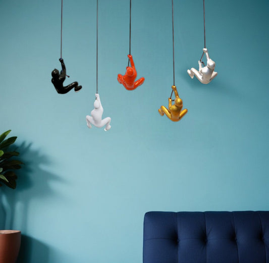 Set of Five Black Gold Orange Silver And White Resin Climbing Man Hanging Dimensional Sculpture